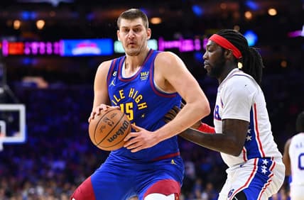 Jan 28, 2023; Philadelphia, Pennsylvania, USA; Denver Nuggets center Nikola Jokic (15) controls the ball against Philadelphia 76ers center Montrezl Harrell (5) in the first quarter at Wells Fargo Center. Mandatory Credit: Kyle Ross-USA TODAY Sports