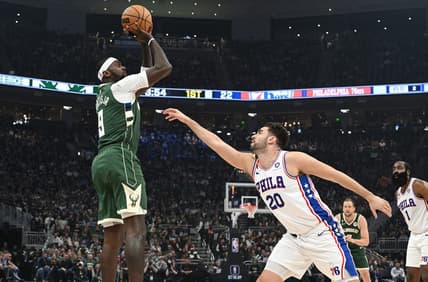 Mar 4, 2023; Milwaukee, Wisconsin, USA; Milwaukee Bucks forward Bobby Portis (9) shoots the ball against Philadelphia 76ers forward Georges Niang (20) in the first half at Fiserv Forum. Mandatory Credit: Michael McLoone-USA TODAY Sports
