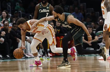 Apr 25, 2023; Boston, Massachusetts, USA; Atlanta Hawks guard Trae Young (11) gathers in a loose ball next to Boston Celtics guard Derrick White (9) during the third quarter of game five of the 2023 NBA playoffs at TD Garden. Mandatory Credit: Winslow Townson-USA TODAY Sports
