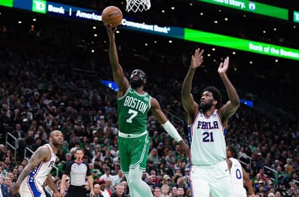 May 3, 2023; Boston, Massachusetts, USA; Boston Celtics guard Jaylen Brown (7) drives to the basket against Philadelphia 76ers center Joel Embiid (21) in the third quarter during game two of the 2023 NBA playoffs at TD Garden. Mandatory Credit: David Butler II-USA TODAY Sports
