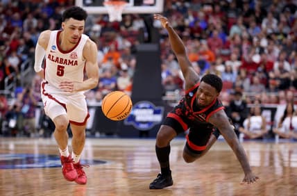 Mar 24, 2023; Louisville, KY, USA; San Diego State Aztecs guard Darrion Trammell (12) and Alabama Crimson Tide guard Jahvon Quinerly (5) chase a loose ball during the second half of the NCAA tournament round of sixteen at KFC YUM! Center. Mandatory Credit: Jordan Prather-USA TODAY Sports