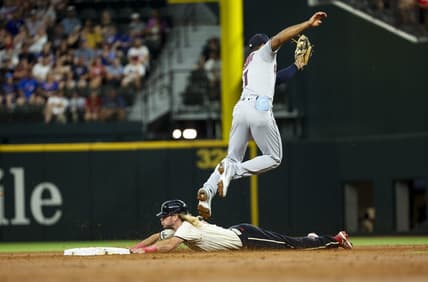 Jul 15, 2023; Arlington, Texas, USA;  Texas Rangers left fielder Travis Jankowski (16) slides safely into second base ahead of the tag by Cleveland Guardians shortstop Amed Rosario (1) during the second inning at Globe Life Field. Mandatory Credit: Kevin Jairaj-USA TODAY Sports