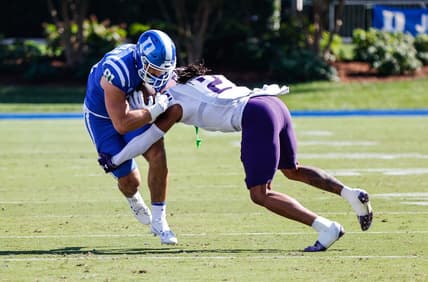 Sep 16, 2023; Durham, North Carolina, USA;  Northwestern Wildcats defensive back Garnett Hollis Jr. (2) tackles Duke Blue Devils running back Grissim Anderson (41) during the first half against Duke Blue Devils at Wallace Wade Stadium. Mandatory Credit: Jaylynn Nash-USA TODAY Sports