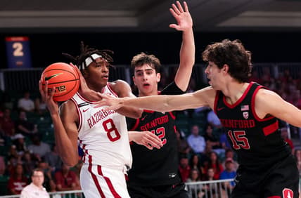 Nov 22, 2023; Paradise Island, BAHAMAS;  Arkansas Razorbacks forward Chandler Lawson (8) looks to pass as Stanford Cardinal guard Benny Gealer (15) defends during the first half at Imperial Arena. Mandatory Credit: Kevin Jairaj-USA TODAY Sports