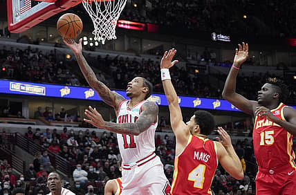 Dec 29, 2021; Chicago, Illinois, USA; Chicago Bulls forward DeMar DeRozan (11) scores against the Atlanta Hawks during the first half at United Center. Mandatory Credit: David Banks-USA TODAY Sports