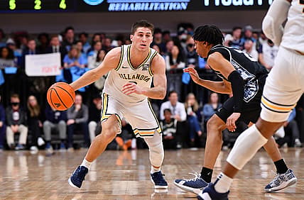 Feb 19, 2022; Villanova, Pennsylvania, USA; Villanova Wildcats guard Collin Gillespie (2) drives against Georgetown Hoyas guard Dante Harris (2) in the first half at William B. Finneran Pavilion. Mandatory Credit: Kyle Ross-USA TODAY Sports
