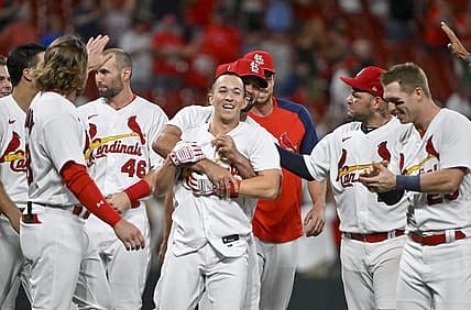 Sep 7, 2022; St. Louis, Missouri, USA;  St. Louis Cardinals shortstop Tommy Edman (19) celebrates with Albert Pujols (5)  and teammates after hitting a walk-off two run double against the Washington Nationals during the ninth inning at Busch Stadium. Mandatory Credit: Jeff Curry-USA TODAY Sports