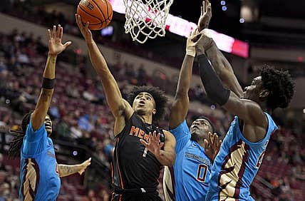 Nov 21, 2022; Tallahassee, Florida, USA; Mercer Bears guard Kamar Robertson (1) shoots the ball past Florida State Seminoles defenders during the first half at Donald L. Tucker Center. Mandatory Credit: Melina Myers-USA TODAY Sports