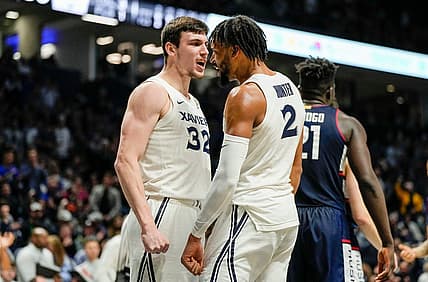 Xavier Musketeers forward Zach Freemantle (32) and  Jerome Hunter (2) celebrate after Hunter is fouled by the Connecticut Huskies Saturday, December 31, 2022 at the Cintas Center. The Musketeers upset the Huskies 83-73.

Xavier Uconn10