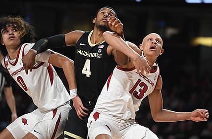 Jan 14, 2023; Nashville, Tennessee, USA; Vanderbilt Commodores guard Jordan Wright (4) battles with Arkansas Razorbacks guard Jordan Walsh (13) and guard Anthony Black (0) for a rebound during the first half at Memorial Gymnasium. Mandatory Credit: Christopher Hanewinckel-USA TODAY Sports