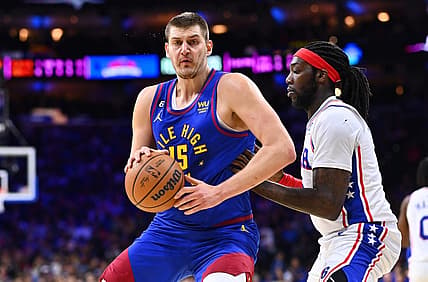 Jan 28, 2023; Philadelphia, Pennsylvania, USA; Denver Nuggets center Nikola Jokic (15) controls the ball against Philadelphia 76ers center Montrezl Harrell (5) in the first quarter at Wells Fargo Center. Mandatory Credit: Kyle Ross-USA TODAY Sports
