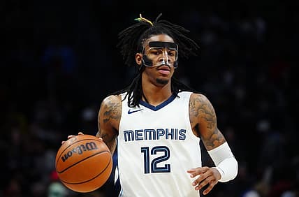 Mar 3, 2023; Denver, Colorado, USA; Memphis Grizzlies guard Ja Morant (12) dribbles during the first quarter against the Denver Nuggets at Ball Arena. Mandatory Credit: Ron Chenoy-USA TODAY Sports