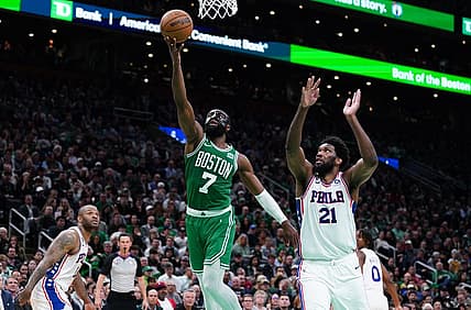May 3, 2023; Boston, Massachusetts, USA; Boston Celtics guard Jaylen Brown (7) drives to the basket against Philadelphia 76ers center Joel Embiid (21) in the third quarter during game two of the 2023 NBA playoffs at TD Garden. Mandatory Credit: David Butler II-USA TODAY Sports