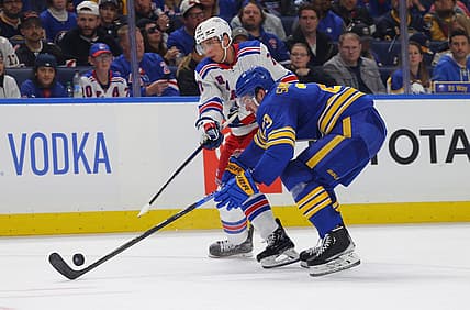 Oct 12, 2023; Buffalo, New York, USA;  Buffalo Sabres defenseman Mattias Samuelsson (23) blocks a shot by New York Rangers center Tyler Pitlick (71) during the second period at KeyBank Center. Mandatory Credit: Timothy T. Ludwig-USA TODAY Sports
