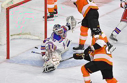 Mar 25, 2021; Philadelphia, Pennsylvania, USA; New York Rangers goaltender Igor Shesterkin (31) makes a save against Philadelphia Flyers center Claude Giroux (28) during the first period at Wells Fargo Center. Mandatory Credit: Eric Hartline-USA TODAY Sports
