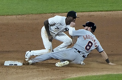 Apr 27, 2021; Chicago, Illinois, USA; Detroit Tigers left fielder Robbie Grossman (8) slides in safely into second base ahead of the tag by Chicago White Sox shortstop Tim Anderson (7) during the sixth inning at Guaranteed Rate Field. Mandatory Credit: Mike Dinovo-USA TODAY Sports