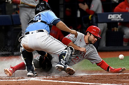 Jun 25, 2021; St. Petersburg, Florida, USA;  Los Angeles Angels second baseman David Fletcher (22) scores a run as Tampa Bay Rays catcher Francisco Mejia (28) drops the balls in the third inning at Tropicana Field. Mandatory Credit: Jonathan Dyer-USA TODAY Sports
