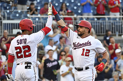 Jun 29, 2021; Washington, District of Columbia, USA; Washington Nationals left fielder Kyle Schwarber (12) is congratulated by left fielder Juan Soto (22) after hitting a solo home run during the first inning at Nationals Park. Mandatory Credit: Brad Mills-USA TODAY Sports