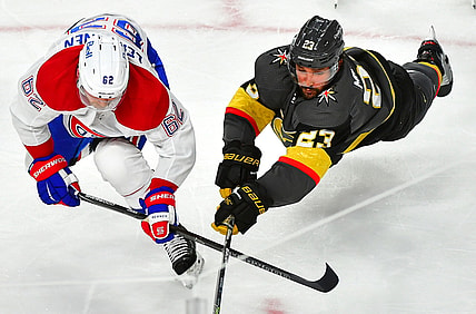 Jun 16, 2021; Las Vegas, Nevada, USA;Vegas Golden Knights defenseman Alec Martinez (23) dives to tip a puck away from the reach of Montreal Canadiens left wing Artturi Lehkonen (62) during the second period of game two of the 2021 Stanley Cup Semifinals at T-Mobile Arena. Mandatory Credit: Stephen R. Sylvanie-USA TODAY Sports