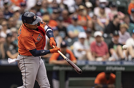 Jul 28, 2021; Seattle, Washington, USA;  Houston Astros first baseman Yuli Gurriel (10) hits a RBI-double off of Seattle Mariners starting pitcher Yusei Kikuchi (18)during the third inning of a game at T-Mobile Park. Mandatory Credit: Stephen Brashear-USA TODAY Sports