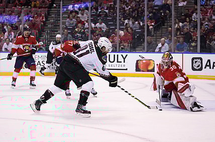 Oct 25, 2021; Sunrise, Florida, USA; Florida Panthers goaltender Spencer Knight (30) blocks the shot of Arizona Coyotes right wing Phil Kessel (81) during the first period at FLA Live Arena. Mandatory Credit: Jasen Vinlove-USA TODAY Sports