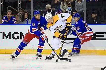 Dec 12, 2021; New York, New York, USA; Nashville Predators right wing Michael McCarron (47) fights for the puck with New York Rangers right wing Ryan Reaves (75) and New York Rangers defenseman Libor Hajek (25) during the second period at Madison Square Garden. Mandatory Credit: Danny Wild-USA TODAY Sports