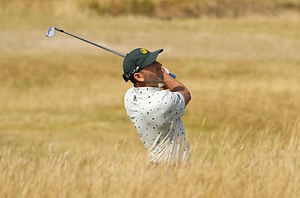 Jul 16, 2022; St. Andrews, SCT; Sergio Garcia plays his second shot on the 13th hole during the third round of the 150th Open Championship golf tournament. Mandatory Credit: Rob Schumacher-USA TODAY Sports