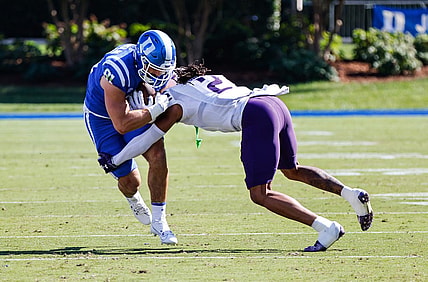 Sep 16, 2023; Durham, North Carolina, USA;  Northwestern Wildcats defensive back Garnett Hollis Jr. (2) tackles Duke Blue Devils running back Grissim Anderson (41) during the first half against Duke Blue Devils at Wallace Wade Stadium. Mandatory Credit: Jaylynn Nash-USA TODAY Sports