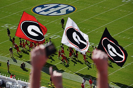 The Bulldog cheerleaders run out on the field ahead of the team before the start of the annual Florida vs Georgia football game at EverBank Stadium in Jacksonville, FL, Saturday, October 27, 2023. [Bob Self/Florida Times-Union]