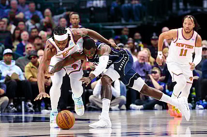 Jan 11, 2024; Dallas, Texas, USA; New York Knicks forward Precious Achiuwa (5) and Dallas Mavericks forward Tim Hardaway Jr. (10) go for a loose ball during the first half at American Airlines Center. Mandatory Credit: Kevin Jairaj-USA TODAY Sports