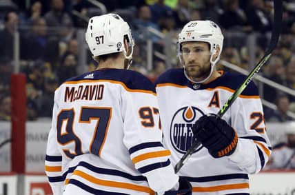 Apr 26, 2022; Pittsburgh, Pennsylvania, USA; Edmonton Oilers center Connor McDavid (97) and center Leon Draisaitl (29) talk prior to a face-off against the Pittsburgh Penguins during the first period at PPG Paints Arena. Mandatory Credit: Charles LeClaire-USA TODAY Sports