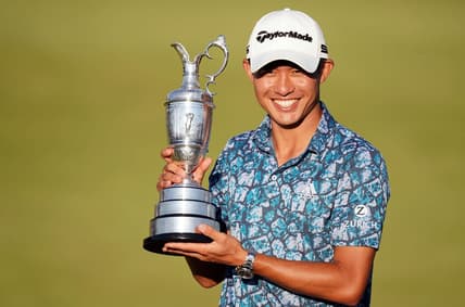 Jul 18, 2021; Sandwich, England, GBR; Collin Morikawa celebrates with the Claret Jug on the 18th green following his final round winning the Open Championship golf tournament. Mandatory Credit: Peter van den Berg-USA TODAY Sports