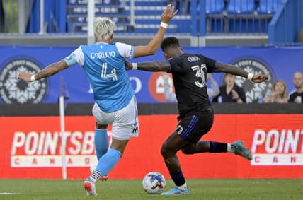 Jun 25, 2022; Montreal, Quebec, CAN; CF Montreal midfielder Romell Quioto (30) scores a goal against Charlotte FC during the first half at Stade Saputo. Mandatory Credit: Eric Bolte-USA TODAY Sports