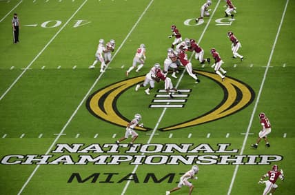 Jan 11, 2021; Miami Gardens, FL, USA; General view as quarterback Justin Fields (1) hands off to running back Master Teague III (33) against the Alabama Crimson Tide in the second quarter in the 2021 College Football Playoff National Championship Game at Hard Rock Stadium. Mandatory Credit: Douglas DeFelice-USA TODAY Sports