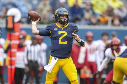 Oct 30, 2021; Morgantown, West Virginia, USA; West Virginia Mountaineers quarterback Jarret Doege (2) throws a pass during the first quarter against the Iowa State Cyclones at Mountaineer Field at Milan Puskar Stadium. Mandatory Credit: Ben Queen-USA TODAY Sports