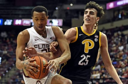 Feb 11, 2023; Tallahassee, Florida, USA; Pittsburgh Panthers forward Guillermo Diaz Graham (25) fights for a rebound against Florida State Seminoles guard Matthew Cleveland (35) during the second half at Donald L. Tucker Center. Mandatory Credit: Melina Myers-USA TODAY Sports
