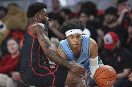 Feb 22, 2023; Houston, Texas, USA; Tulane Green Wave guard Jalen Cook (3) controls the ball as Houston Cougars guard Jamal Shead (1) defends during the first half at Fertitta Center. Mandatory Credit: Troy Taormina-USA TODAY Sports
