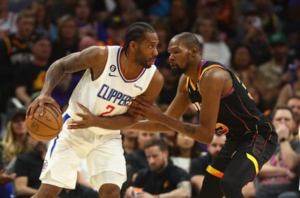 Apr 18, 2023; Phoenix, Arizona, USA; Los Angeles Clippers forward Kawhi Leonard (2) controls the ball against Phoenix Suns forward Kevin Durant (35) in the second half during game two of the 2023 NBA playoffs at Footprint Center. Mandatory Credit: Mark J. Rebilas-USA TODAY Sports