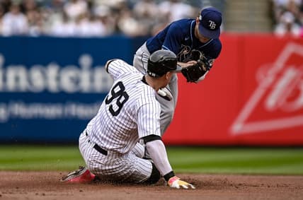 May 13, 2023; Bronx, New York, USA; Tampa Bay Rays second baseman Taylor Walls (6) forces out New York Yankees center fielder Aaron Judge (99) at second base at Yankee Stadium. Mandatory Credit: John Jones-USA TODAY Sports