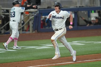 May 14, 2023; Miami, Florida, USA;  Miami Marlins first baseman Garrett Cooper (26) scores a run in the seventh inning against the Cincinnati Reds at loanDepot Park. Mandatory Credit: Jim Rassol-USA TODAY Sports