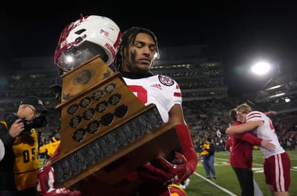 Nebraska safety Myles Farmer carries the Heroes Trophy off the field after the Cornhuskers beat Iowa, 24-17, on Friday, Nov. 25, 2022, at Kinnick Stadium in Iowa City.

Iowavsneb 20221125 Bh