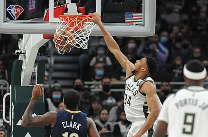 Jan 1, 2022; Milwaukee, Wisconsin, USA;  Milwaukee Bucks forward Giannis Antetokounmpo (34) dunks the ball against the New Orleans Pelicans in the first half at Fiserv Forum. Mandatory Credit: Michael McLoone-USA TODAY Sports