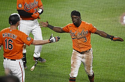 Jul 23, 2022; Baltimore, Maryland, USA;  Baltimore Orioles shortstop Jorge Mateo (3) celebrates with designated hitter Trey Mancini (16) after scoring a run against the New York Yankees during the seventh inning at Oriole Park at Camden Yards. Mandatory Credit: James A. Pittman-USA TODAY Sports