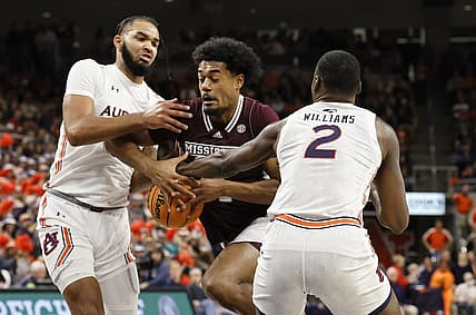 Jan 14, 2023; Auburn, Alabama, USA;  Auburn Tigers forwards Johni Broome (4) and Auburn Jaylin Williams (2) strip the ball from Mississippi State Bulldogs forward Tolu Smith (1) during the first half at Neville Arena. Mandatory Credit: John Reed-USA TODAY Sports