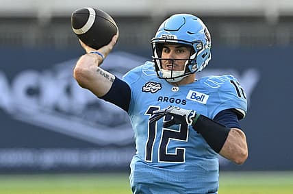 Jun 18, 2023; Toronto, Ontario, CAN;  Toronto Argonauts quarterback Chad Kelly (12) throws a pass against the Hamilton Tiger-Cats in the second quarter at BMO Field. Mandatory Credit: Dan Hamilton-USA TODAY Sports