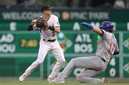 May 26, 2021; Pittsburgh, Pennsylvania, USA;  Pittsburgh Pirates shortstop Kevin Newman (27) forces Chicago Cubs first baseman Kris Bryant (17) out at second base during the second inning at PNC Park. Mandatory Credit: Charles LeClaire-USA TODAY Sports