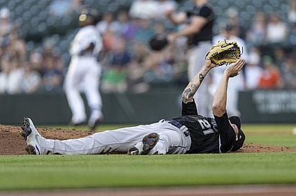 Jun 22, 2021; Seattle, Washington, USA;  Colorado Rockies starting pitcher Kyle Freeland reacts while laying on his back after dodging a ball hit by Seattle Mariners left fielder Shed Long Jr. (4) during the third inning of a game at T-Mobile Park. Mandatory Credit: Stephen Brashear-USA TODAY Sports