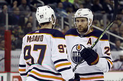 Apr 26, 2022; Pittsburgh, Pennsylvania, USA; Edmonton Oilers center Connor McDavid (97) and center Leon Draisaitl (29) talk prior to a face-off against the Pittsburgh Penguins during the first period at PPG Paints Arena. Mandatory Credit: Charles LeClaire-USA TODAY Sports