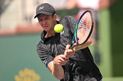 Mar 13, 2023; Indian Wells, CA, USA;  Hubert Hurkacz (POL) hits a shot in his fourth round match against Tommy Paul (USA) during the BNP Paribas Open at the Indian Wells Tennis Garden. Mandatory Credit: Jayne Kamin-Oncea-USA TODAY Sports