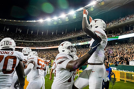 Texas offensive lineman Kelvin Banks Jr. (78) and Texas running back CJ Baxter (4) celebrate a touchdown against Baylor in the second half of an NCAA college football game, Saturday, Sept. 23, 2023, in Waco, Texas.